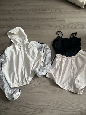 Weissman Black Leotard with White Hooded Dance Jacket and Cream Shorts